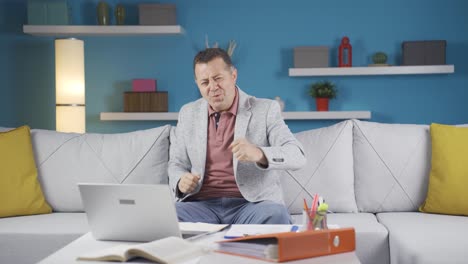 home office worker man dances looking at camera.
