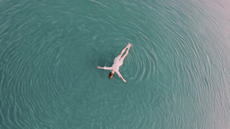 Woman Floating in Calm Water
