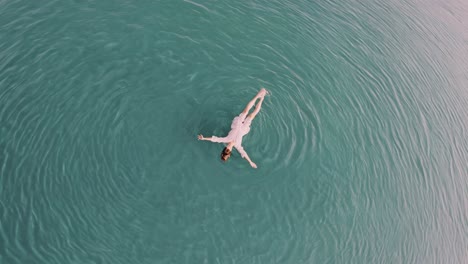 woman floating in calm water