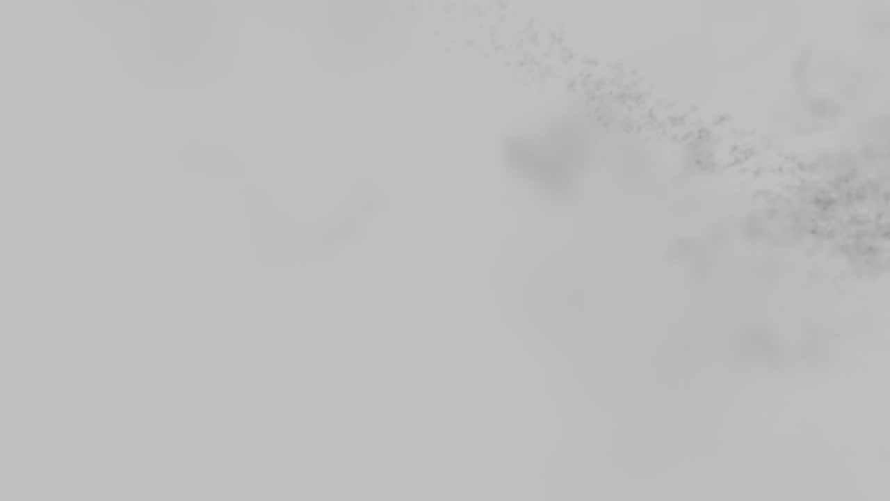 Animation of green and purple shooting powders moving over grey background