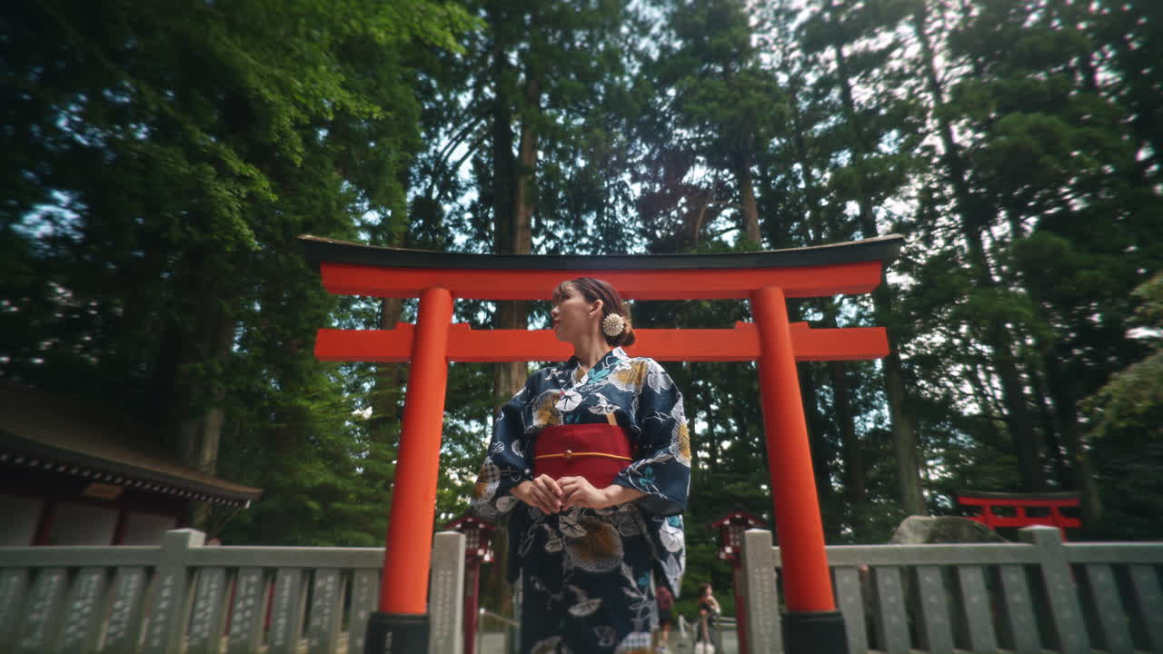 Woman in Kimono at a Torii Gate in Japan