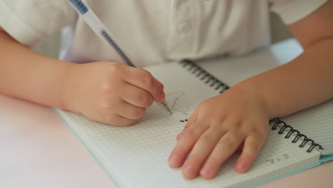 cute toddler boy learns numbers drawing digit two and dots