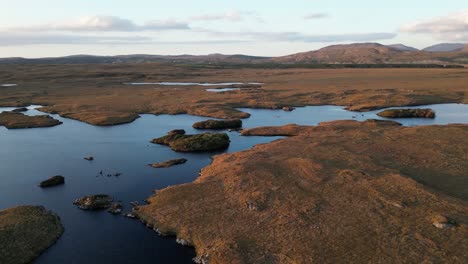 Aerial-of-Connemara,-a-region-of-immense-natural-beauty-in-Ireland,-renowned-for-its-abundance-of-rushing-rivers,-tranquil-lakes,-and-the-unique-distinction-of-being-home-to-Ireland's-only-fjord