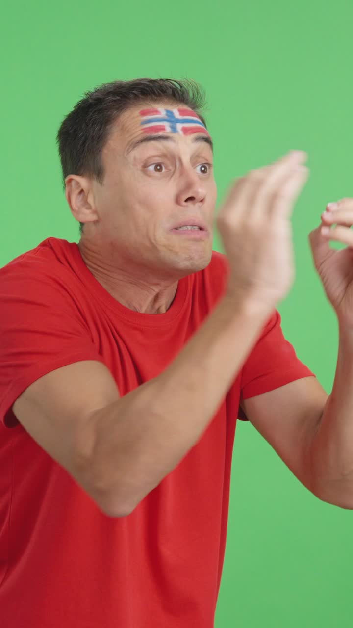 Man cheering for Norway, angry with the decision of referee