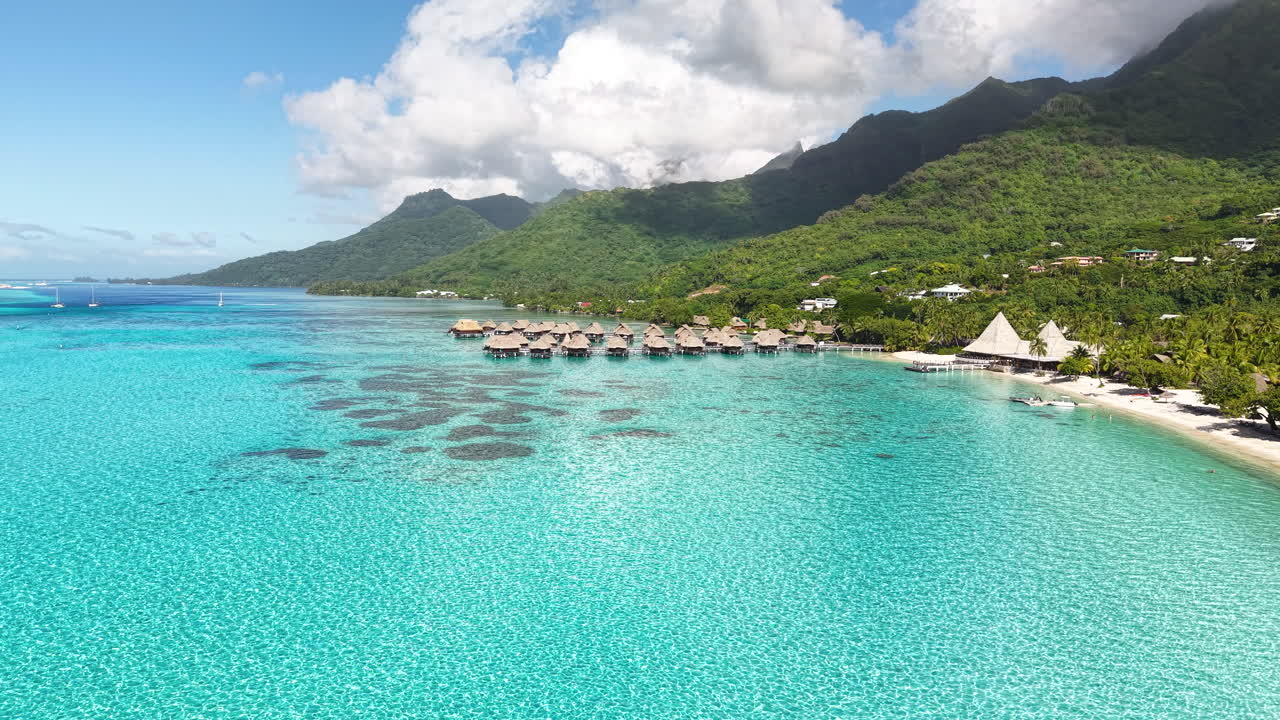 Moorea Island, French Polynesia. Drone Shot of Luxury Tropical Resort, Overwater Bungalows in Turquoise Lagoon