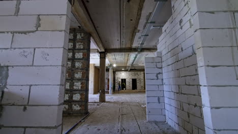 new construction hall under development. interior view of an unfinished construction site with exposed walls and scaffolding, showcasing progress and structure