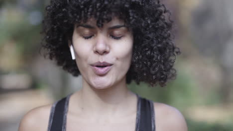 Breathing-relief-post-workout-session-by-mixed-race-black-girl