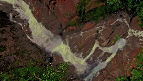 Aerial-of-the-Bijagual-waterwall-with-water-crashing-down-the-cliffs