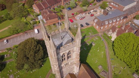 drone shot of an english church tower located in farnham, surrey