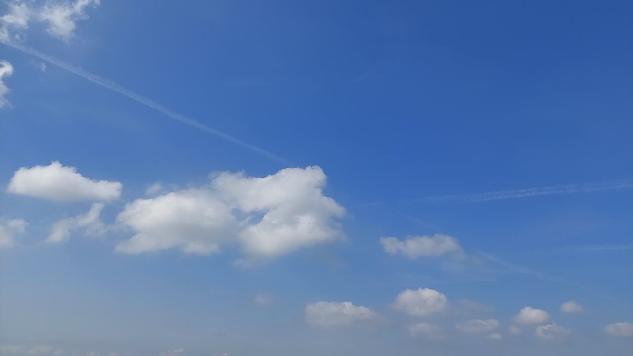 White clouds on the blue sky 4k timelapse video