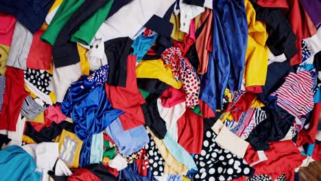 top-down view of a vibrant mix of colorful fabrics with polka dots and stripes, ideal for a fashion