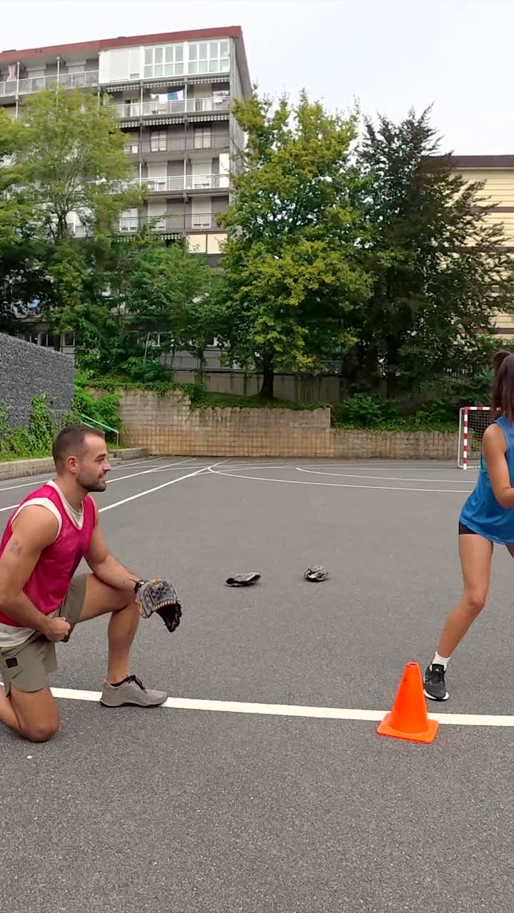 People playing baseball in an urban environment