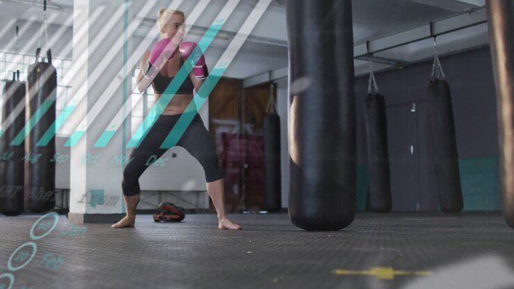 Animation of graph and data processing over caucasian woman boxing