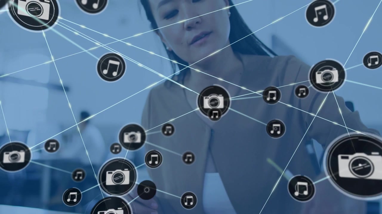 Seated woman moving strips camera icon appearing and expanding network covering hands for marketing