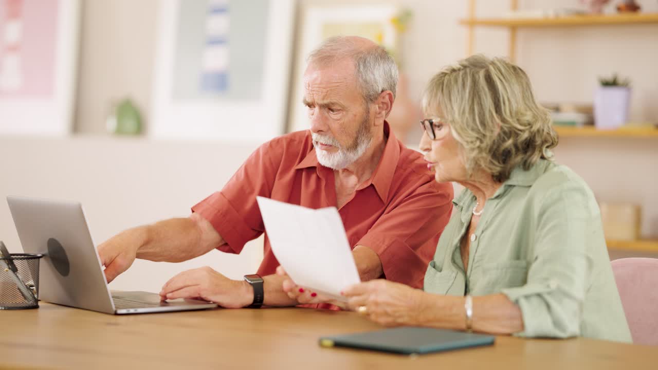 Senior Couple Working at Home