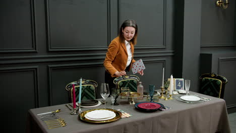 asian woman organizing ornaments on a table