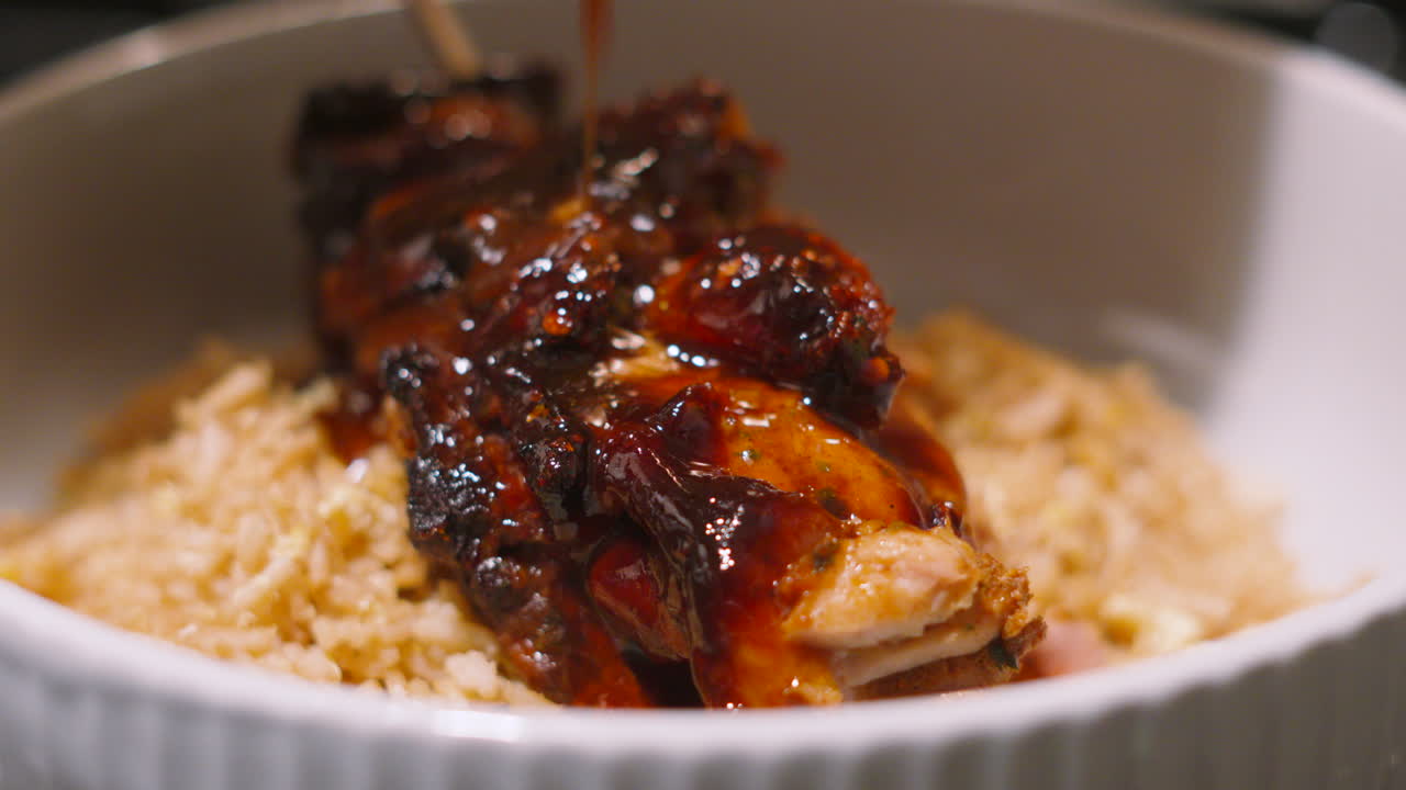 Front View of Sauce Being Drizzled Over Japan Teriyaki Miso Chicken King Kebab with Sweet Sticky Glaze. Japanese Cuisine 4K.