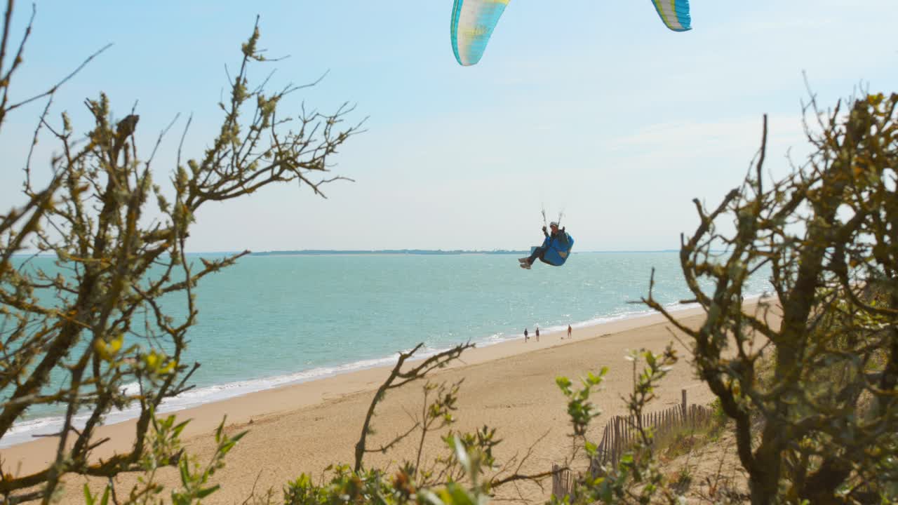 Paragliding On The Beach Of Oleron Island With Fort Boyard Fort Boyard Background In The Atlantic Coast Of France. Wide Shot