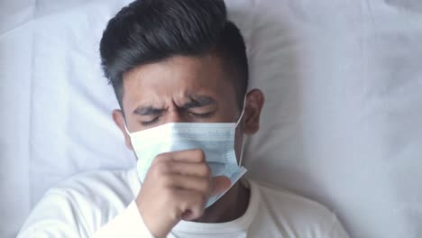 sick person wearing a mask