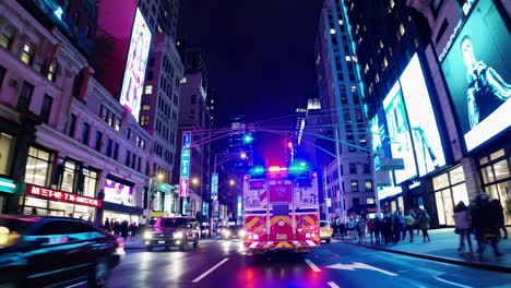 firetruck racing through times square at night, surrounded by vibrant illuminated billboards, bustling traffic, and pedestrians navigating the lively sidewalks of new york city
