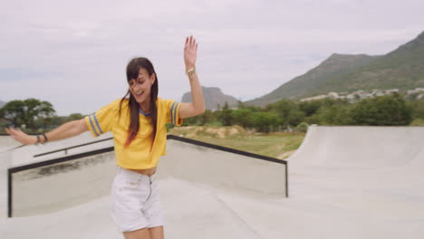 happy woman dancing in a skatepark