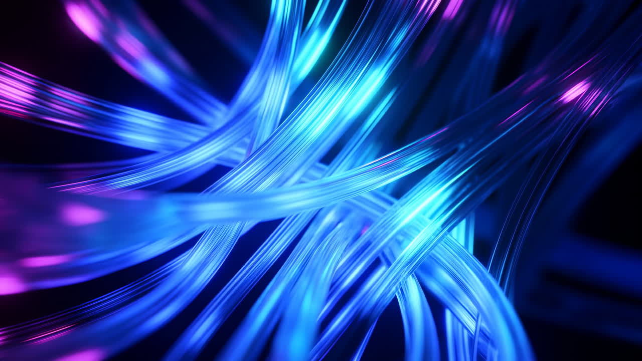 Modré neonové optické vlákna rychle se pohybující přes černé pozadí, kroutící se stuhy modrého a fialového světla.
