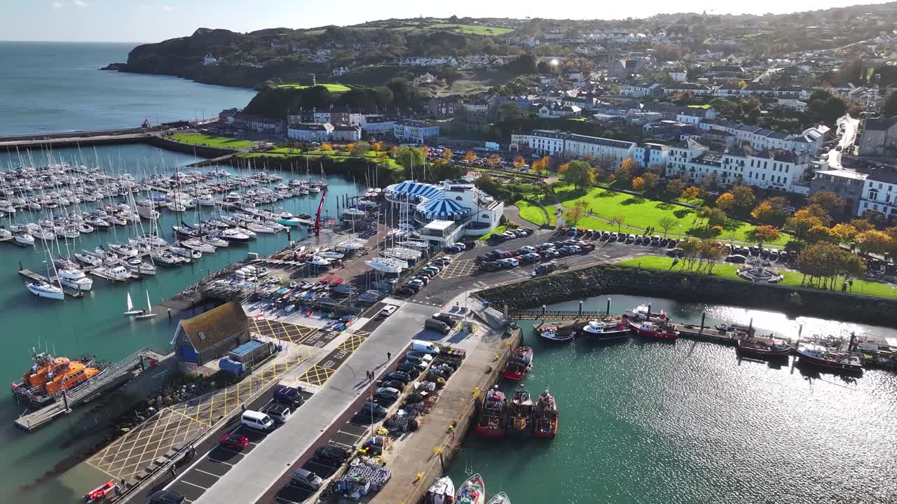 Beautiful aerial of Howth port and promenade, sunny autumn morning, Dublin Ireland