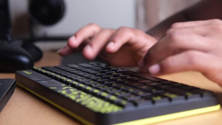 Person Typing on a Computer Keyboard