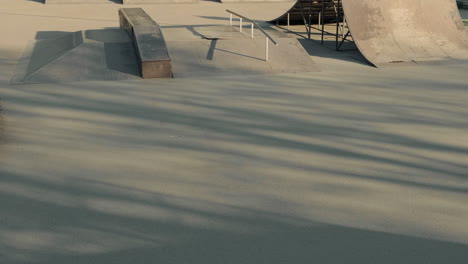 young skater girl crossing a skate park