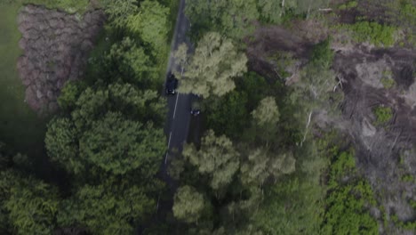 drone aerial tracking birds eye view shot of car in countryside