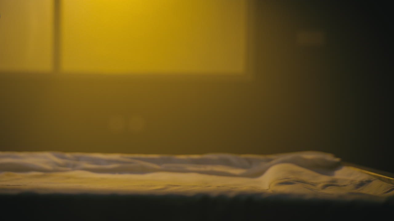 A bald man wakes up in the empty operation room