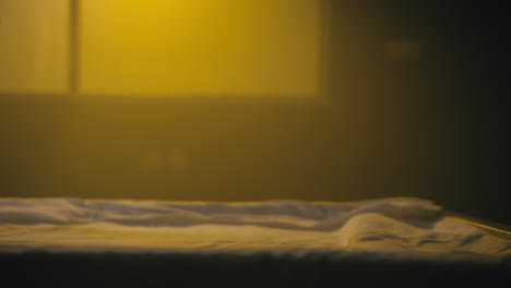a bald man wakes up in the empty operation room