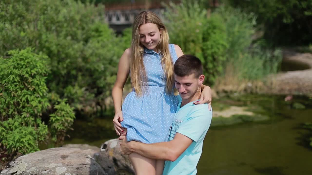 Couple Love Romance. Couple love romance. Young couple in love play on the rivers beach