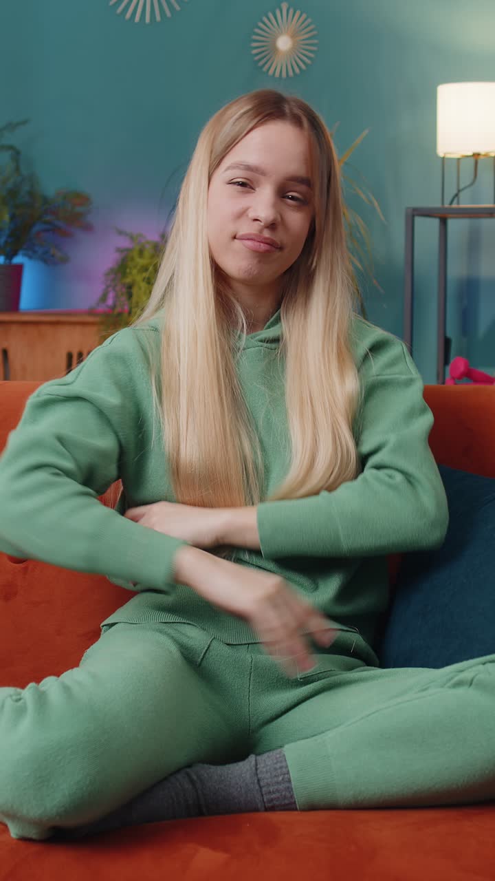 Upset woman lady showing thumbs down dislike bad work disapproval dissatisfied feedback at home