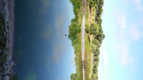 Beautiful-natural-lake-in-sunny-day,-reflection-of-nature-in-the-water