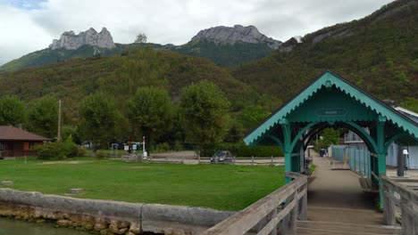 angon pier near lake annecy with a view to mountains