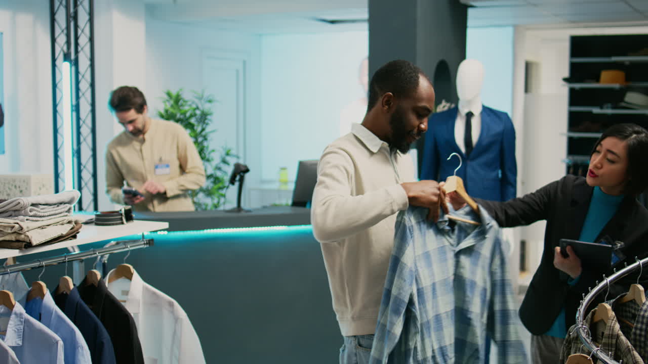 People shopping for clothes in a retail store