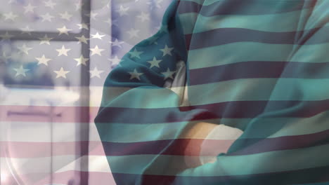animación de la bandera de los estados unidos ondeando sobre los cirujanos con máscaras faciales