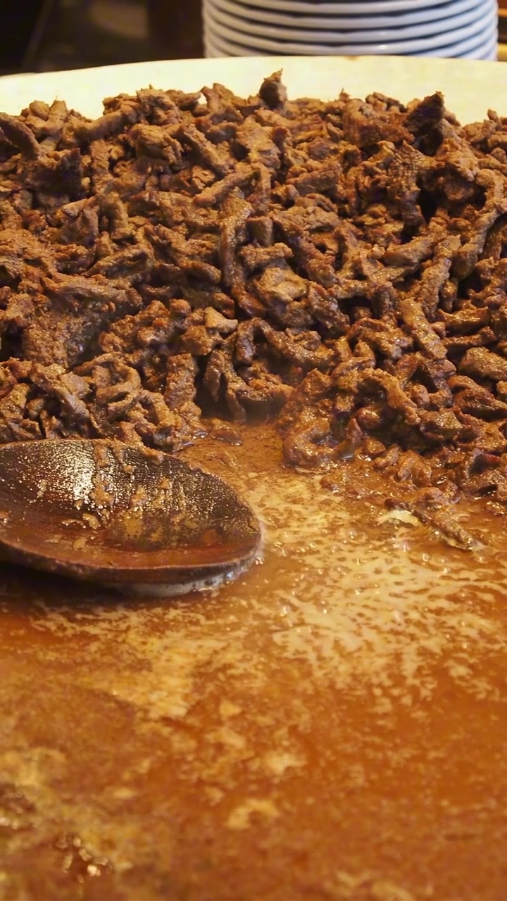 Close-Up of Cooked Shredded Meat with Sauce