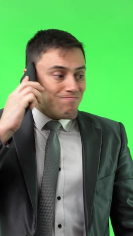 businessman on phone with varied expressions on green screen