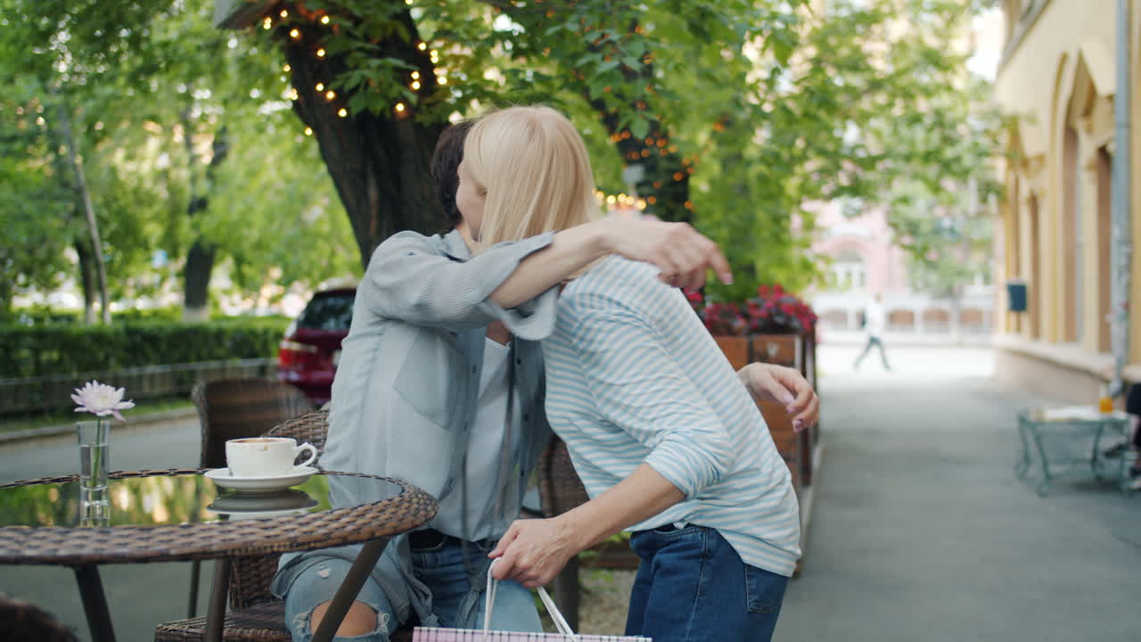 Happy Women Friends Enjoying Time Together at Outdoor Cafe