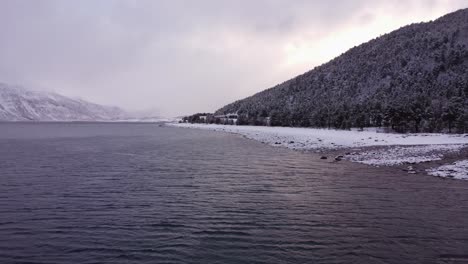 fjords of norway beach covered with snow