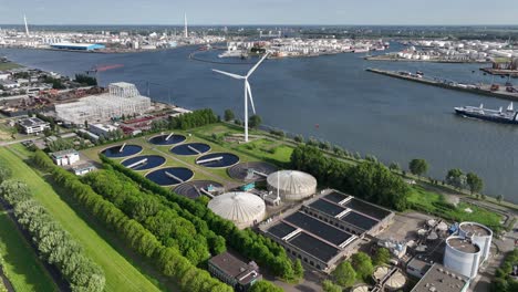 water purification, waste water, treatment, cleaning of water. next to major river, meuse, rotterdam, the netherlands. aerial.