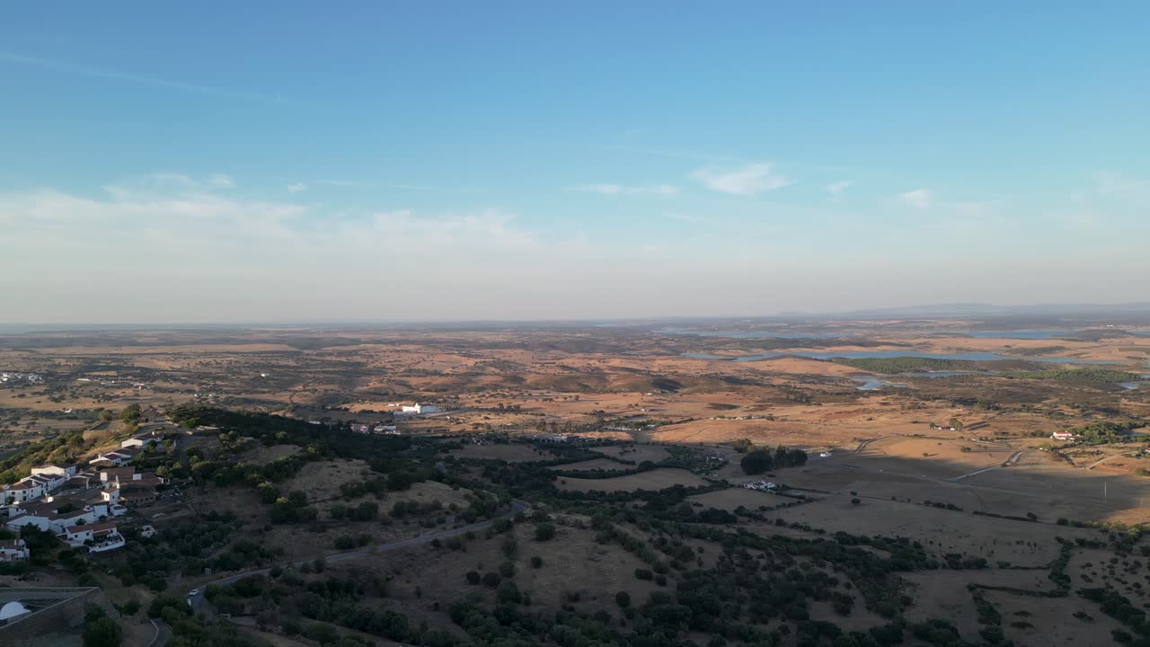 Aerial View of a Rural Landscape with a Village and Reservoir