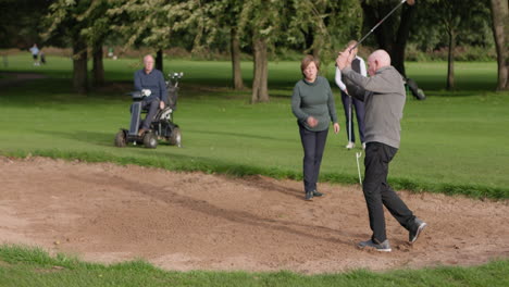 golfers playing on golf course