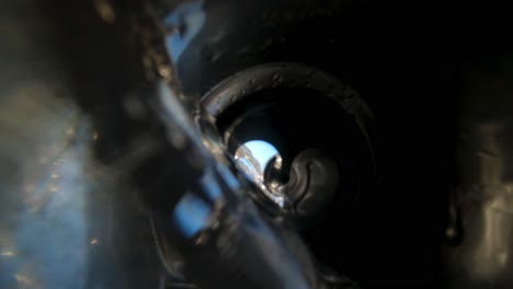 careless tourist throws an empty soda or beer can into the ocean polluting the environment - view from inside the aluminum can