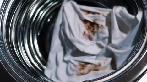 dirty white shirt in a washing machine