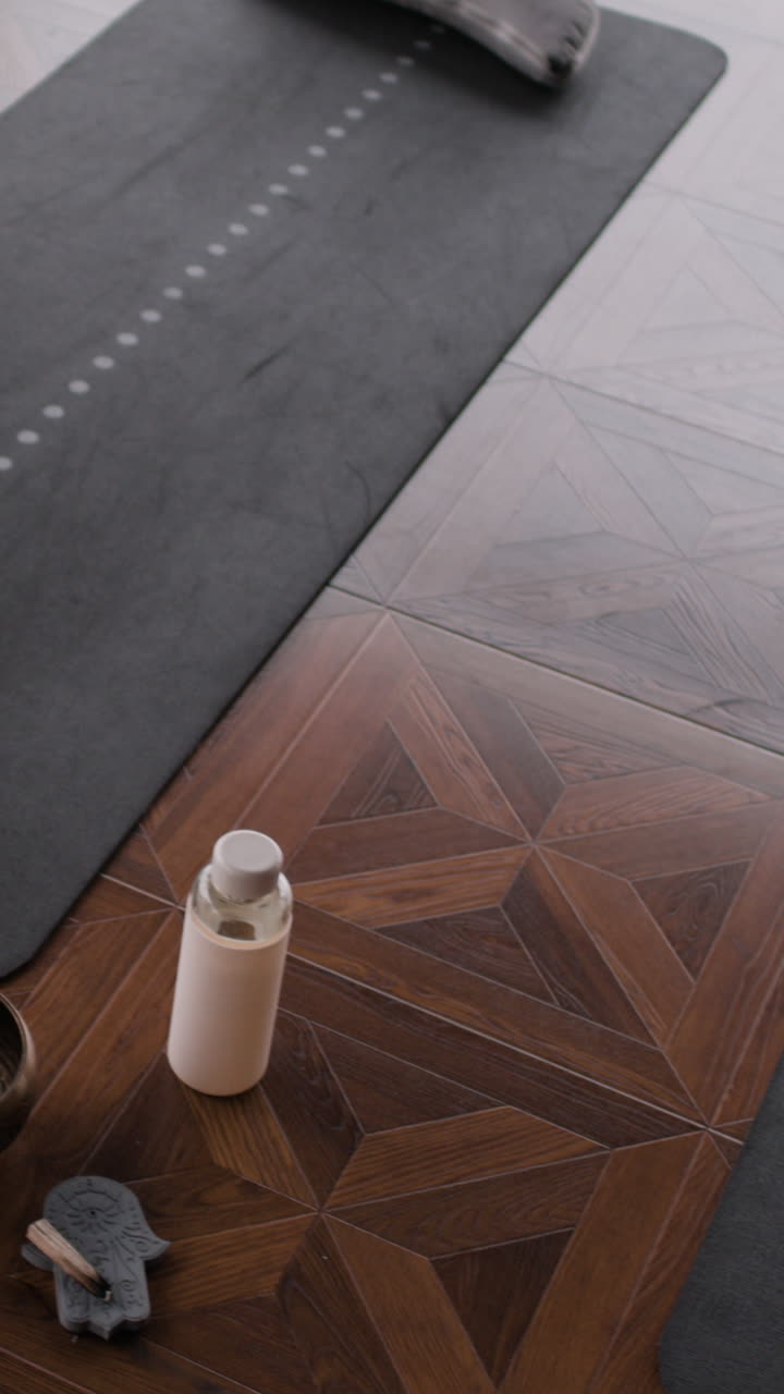 Yoga Mat and Accessories on Wooden Floor