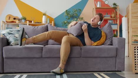 man having fun on couch