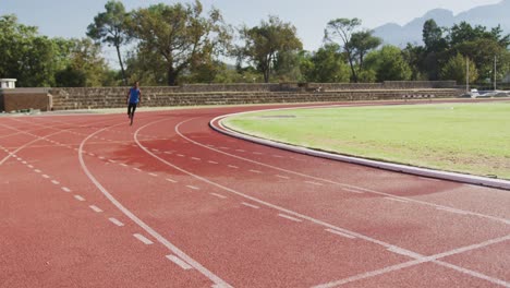 Disabled-mixed-race-man-with-prosthetic-legs-running-on-race-track